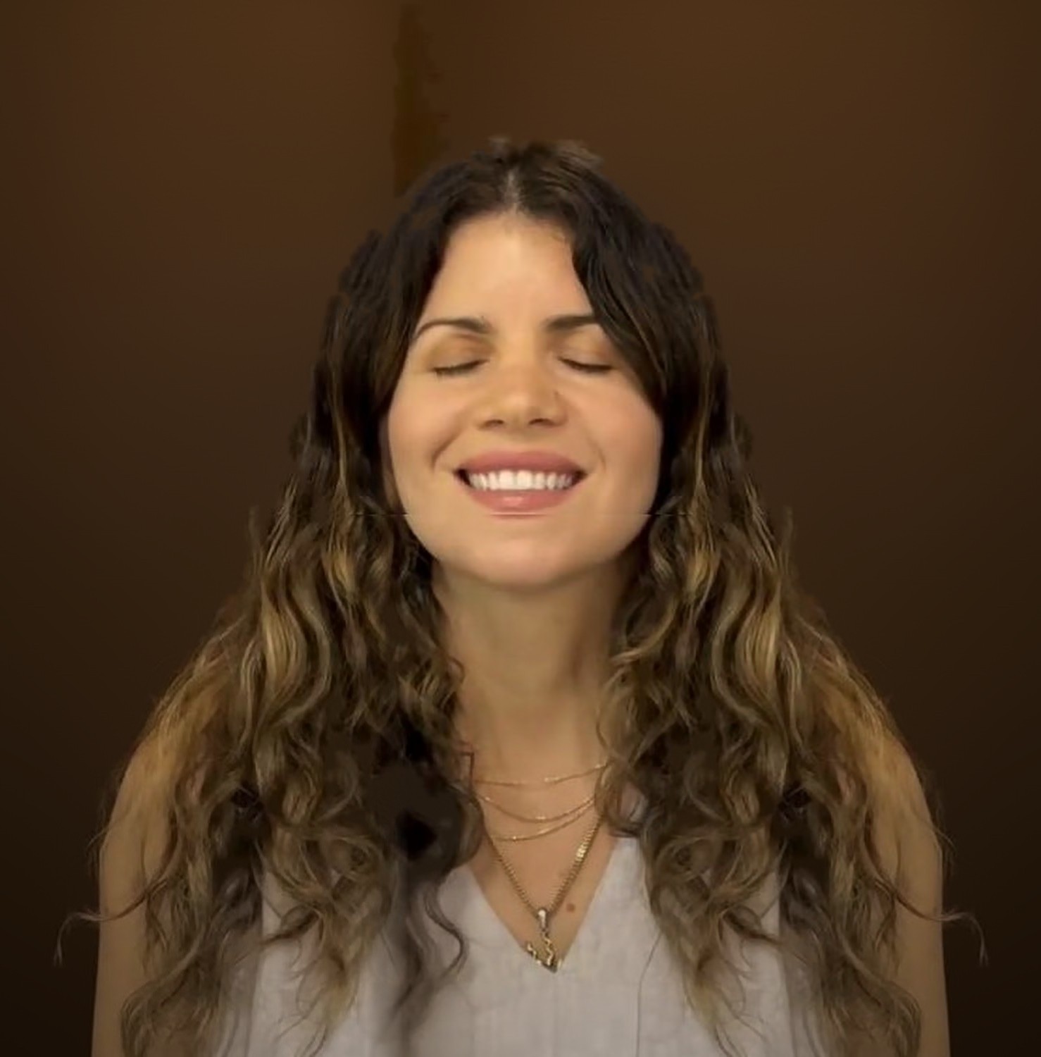 Dr. Laura smiling with her eyes closed, relaxed and at peace